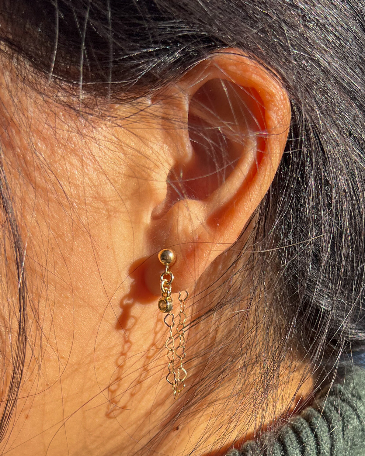Gold ball stud earrings with a dainty heart chain and round bezel cubic zirconia drop.