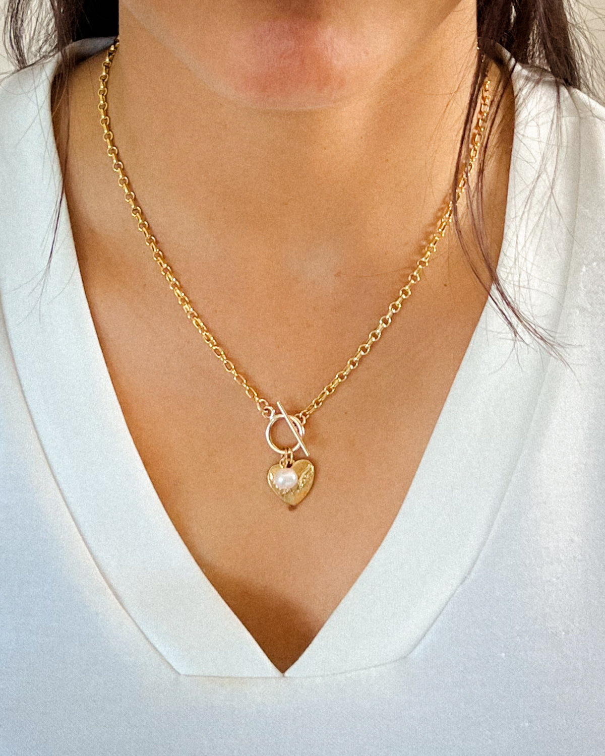 Gold-filled toggle necklace with a heart charm and pearl drop.